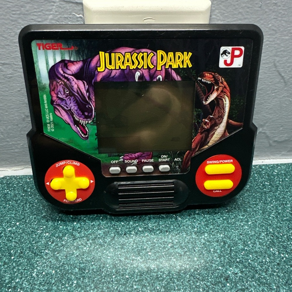 Jurassic Park Black and Yellow Handheld Console game.